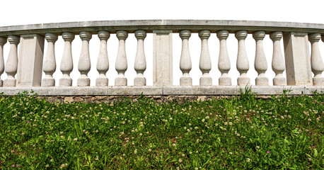 Close-up of a white balustrade with green grass isolated on white background