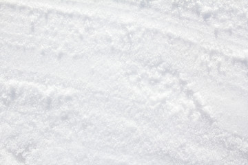 Obraz premium Closeup white clean wet loose snow surface texture background.