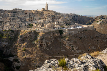Panoramic view of Sassi di Matera a historic district in the city of Matera, well-known for their ancient cave dwellings from the Belvedere di Murgia Timone,  Basilicata, Italy