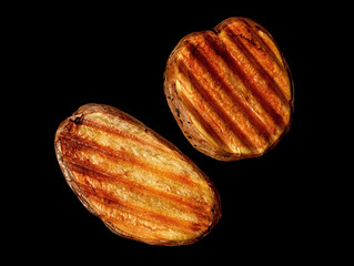 Two slices of grilled potatoes rotated