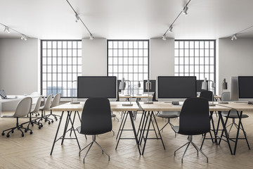 Modern office interior with equipment on desktop