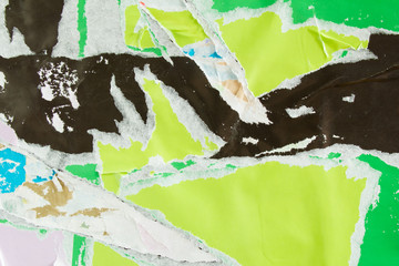 Green and black torn and crumpled pieces of paper poster. Old dirty ripped and peeling grunge paper...