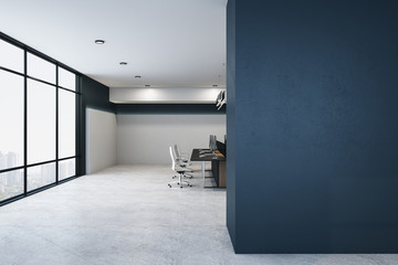 Modern coworking office interior with equipment, furniture and blank wall.