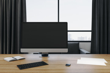 Modern designer desktop with empty computer screen.