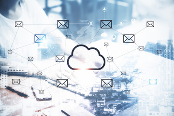 Hands using laptop with creative glowing cloud email map hologram