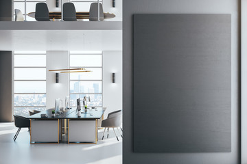 Luxury office room with daylight and empty black poster