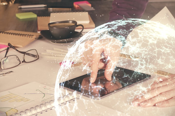 Double exposure of man's hands holding and using a phone and social network theme drawing.