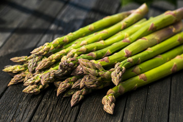 Bunch of fresh asparagus on wooden table