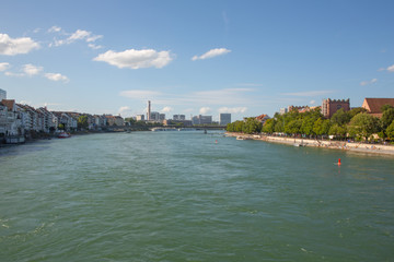 Fototapeta na wymiar Rhine River flow through Basel Old Town, urban section riverside panorama