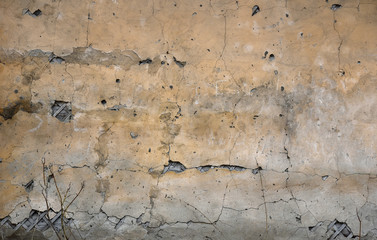 Yellow plastered wall. Texture with plaster stains
