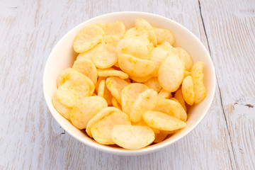 Shrimp chips on wood background