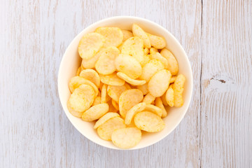 Shrimp chips on wood background