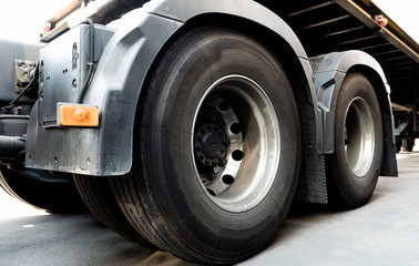 Obraz na płótnie Canvas close up truck wheels of semi truck trailer