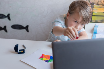 Toddler boy is creativity and the artist in an online drawing paints lesson. Childrens creativity....