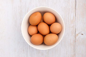 Fresh eggs on wooden background