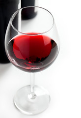 Red wine on white background.
