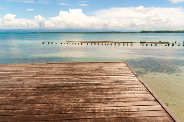 Wooden platform on turquoise sea