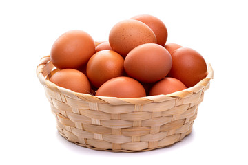 Eggs in a wicker basket. Isolate on white background
