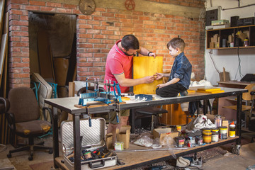 Father and Son Making a Birdhouse