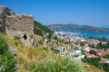 Obraz premium FETHIYE, TURKEY - June, 2019: Fethiye Kalesi at the top of the mountain