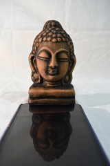Pictures of Gautama Buddha on mobile screen
