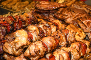 Assorted delicious grilled meat with vegetables over the counter on a barbecue event.