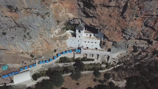 Aerial view of The Monastery of Ostrog, Serbian Orthodox Church situated against a vertical background, high up in the large rock of Ostro&scaron;ka Greda, Montenegro. Dedicated to Saint Basil of Ostrog 