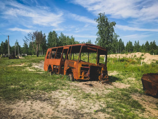 rusty bus in a landfill