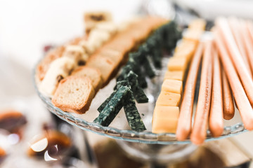 kind of cheese. catering services in restaurant outdoor on wedding ceremony. Food and glass of champagne. restaurant. Set
