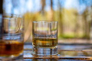 Tasting of scotch single malt whisky from Islay island, most intensely flavoured of all whiskies in Scotland