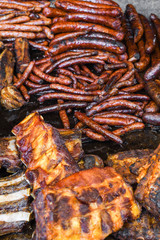 Assorted delicious grilled meat with vegetables over the counter on a barbecue event.