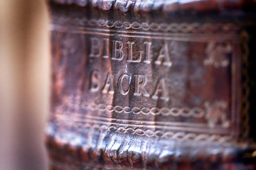 Old leather book spine. Holy bible closeup spine detail.