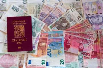 banknotes of different currencies with passport, czech euro IDR CZK PLN