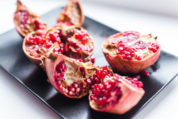 Fresh ripe pomegranate on table close up. Fruit , vitamins and food concept.