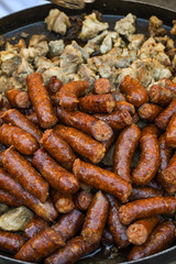 Assorted delicious grilled meat with vegetables over the counter on a barbecue event.