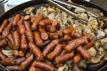 Assorted delicious grilled meat with vegetables over the counter on a barbecue event.