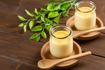 Homemade pudding with copy space on woode background - 手作りプリン