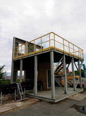 high platform with metal stairs