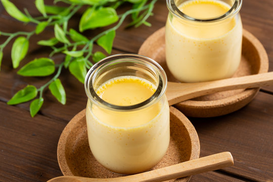 Homemade pudding on woode background - 手作りプリン