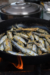 Freshly grilled fish on counter top stall, during seafood festival, street food market.