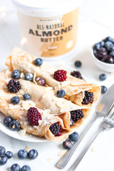 Almond pancakes with fresh berries and almond butter. Healthy breakfast. 