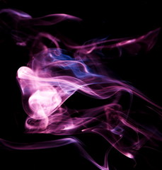 Purple smoke on black background