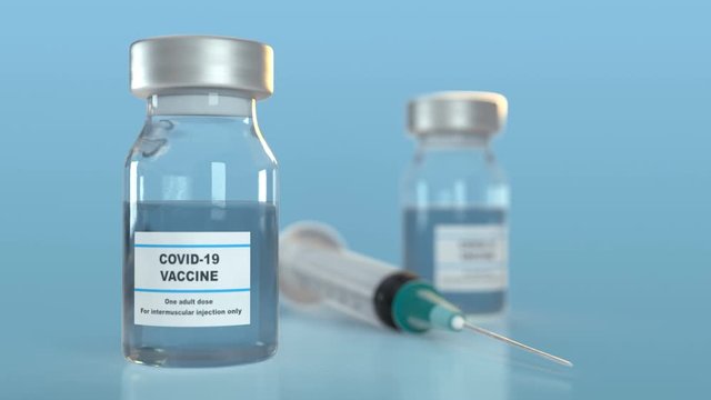 Syringe and vaccine in vials
