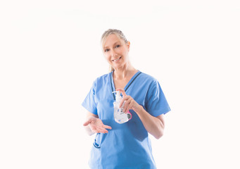 Nurse holding and demonstrating hand hygiene alcohol rub