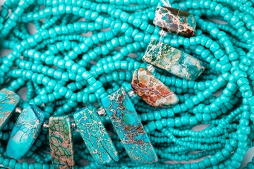 Turquoise stone background. Turquoise necklace with beautiful beads