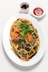 traditional khmer beef stir fry with egg noodles in cambodia