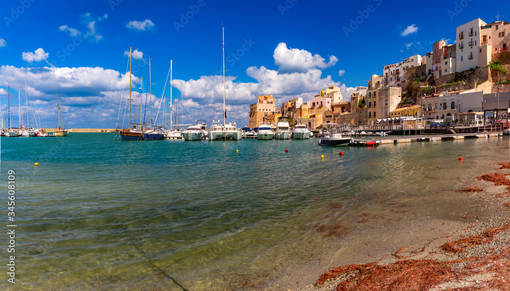 Wall mural panoramic view of sunny medieval fortress in cala marina, harbor in coastal city castellammare del g