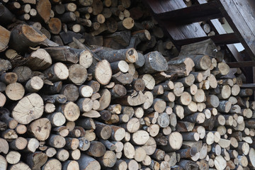 Pile of chopped fire wood prepared for winter. Preparation of firewood for the winter.