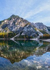 Fototapeta na wymiar Autumn peaceful alpine lake Braies or Pragser Wildsee. Fanes-Sennes-Prags national park, South Tyrol, Dolomites Alps, Italy, Europe.