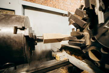 Obraz na płótnie Canvas Product manufacturing Lathe cnc turning works on the tree wood